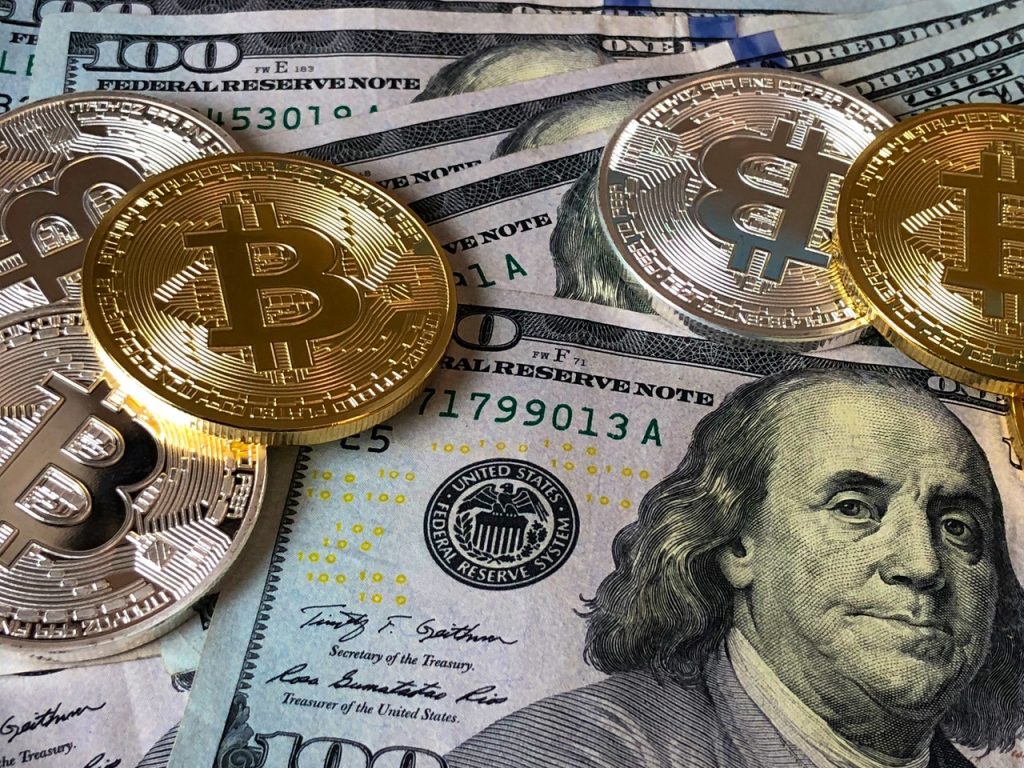 dólar e moedas bitcoin