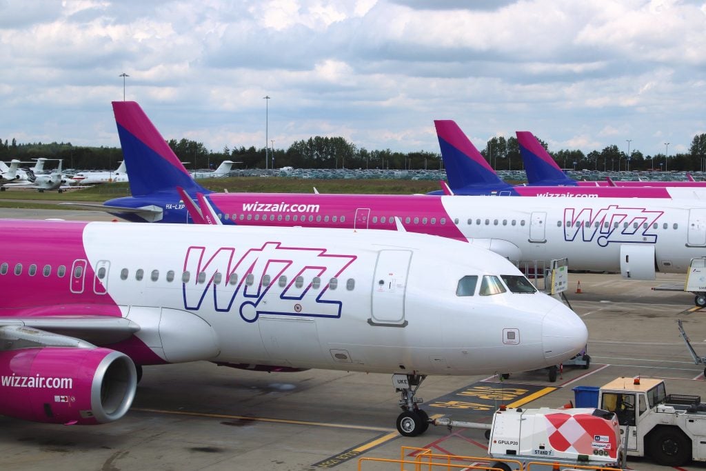 LUTON, UK - JULY 12, 2019: Wizz Air Airbus A320 fleet at London Luton Airport in the UK. It is UK's 5th busiest airport with 16.5 million annual passengers.