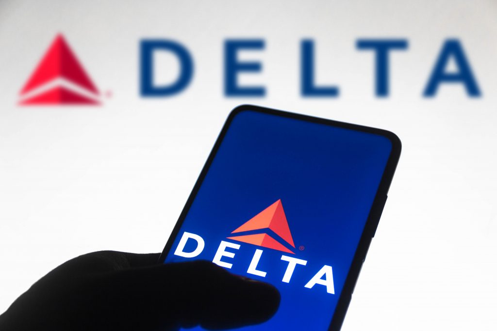 November 10, 2021, Brazil. In this photo illustration the Delta Air Lines logo is seen displayed on a smartphone screen and in the background.